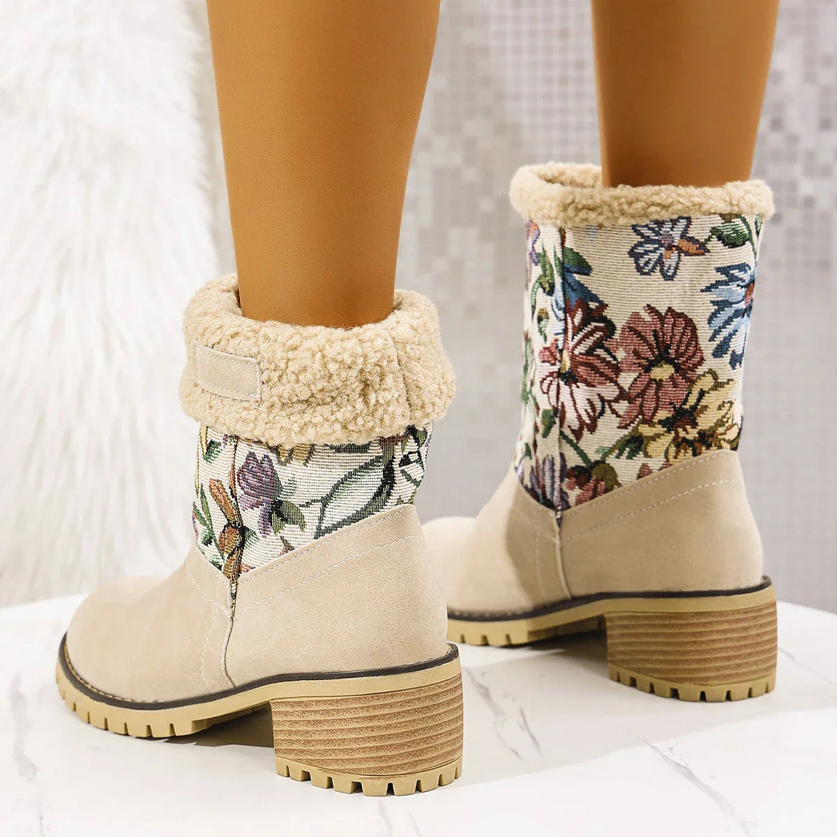 Stylish ethnic-inspired snow boots with floral embroidery, featuring a warm cotton interior and durable suede exterior in a variety of colors.