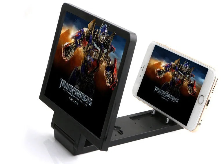 Black and white foldable screen amplifier lens for mobile phones, shown next to a smartphone for scale.