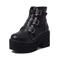 Black women's Harajuku-style punk ankle boots with bat buckle and chunky platform heel.
