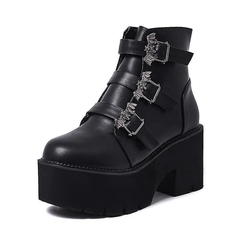 Black women's Harajuku-style punk ankle boots with bat buckle and chunky platform heel.