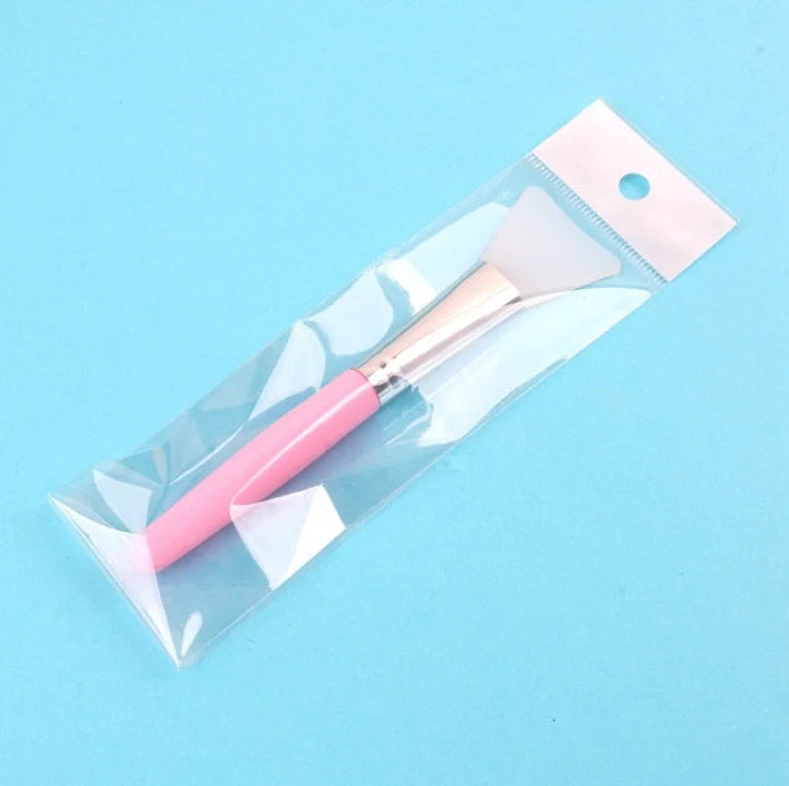 Silicone facial mask brush with 0.5cm bristles and 15cm handle in navy blue colour