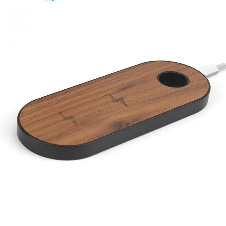 A wooden wireless charging pad made from bamboo with beech wood edging on a desk.