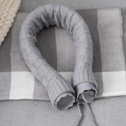 Cozy silicone hot water bottle with knitted cover, providing warmth and relaxation for neck, shoulders, and head