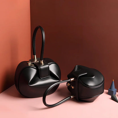 Women's cowhide leather tote bag in tramp shape with single handle and buckle, available in apricot, black, and other colours, big size 35cm x 40cm