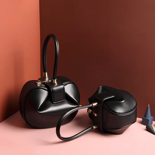 Women's cowhide leather tote bag in tramp shape with single handle and buckle, available in apricot, black, and other colours, big size 35cm x 40cm