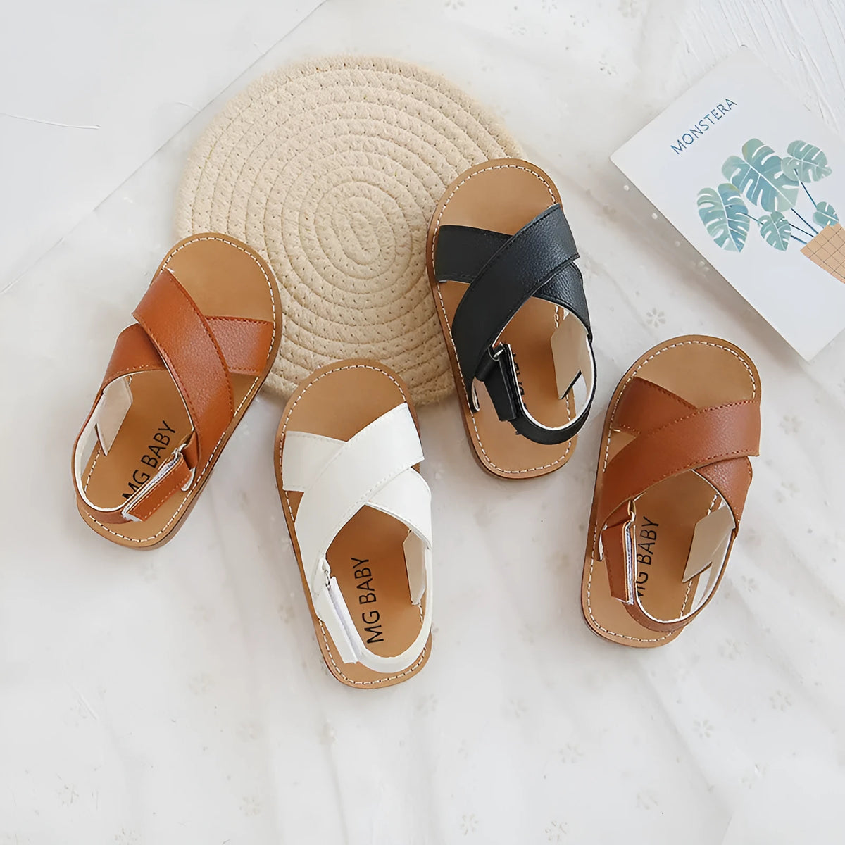 Children's cross strap Velcro sandals in brown, PU upper, beef tendon sole, side view on beach