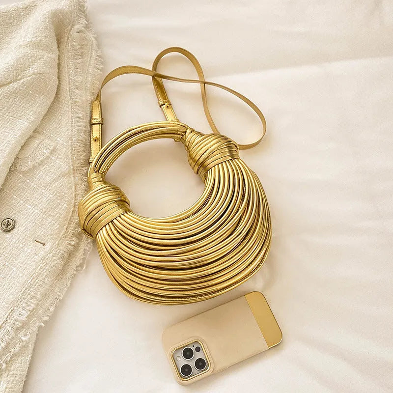 Instafamous Metal Noodles Underarm Bag with shiny metallic surface, chain detail, in gold colour