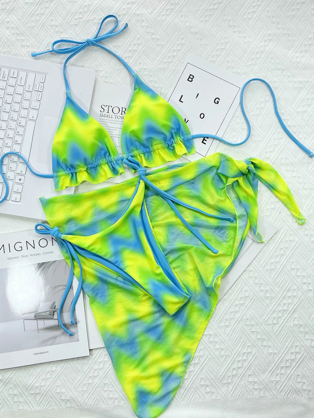 Green tie-dyed women's bikini swimsuit with an outer skirt.