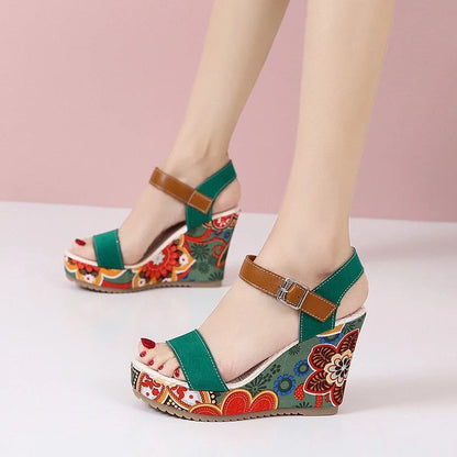 Women's floral embroidered wedge sandals in black, green, and orange with buckle strap