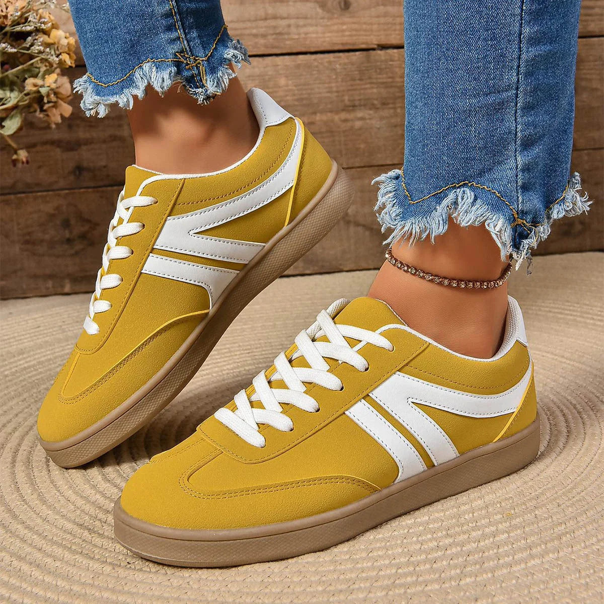 Stylish lace-up flats for women in various colors, perfect for casual wear