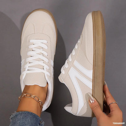 Stylish lace-up flats for women in various colors, perfect for casual wear