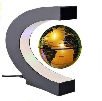 Magnetic levitation globe floating above base with LED light on