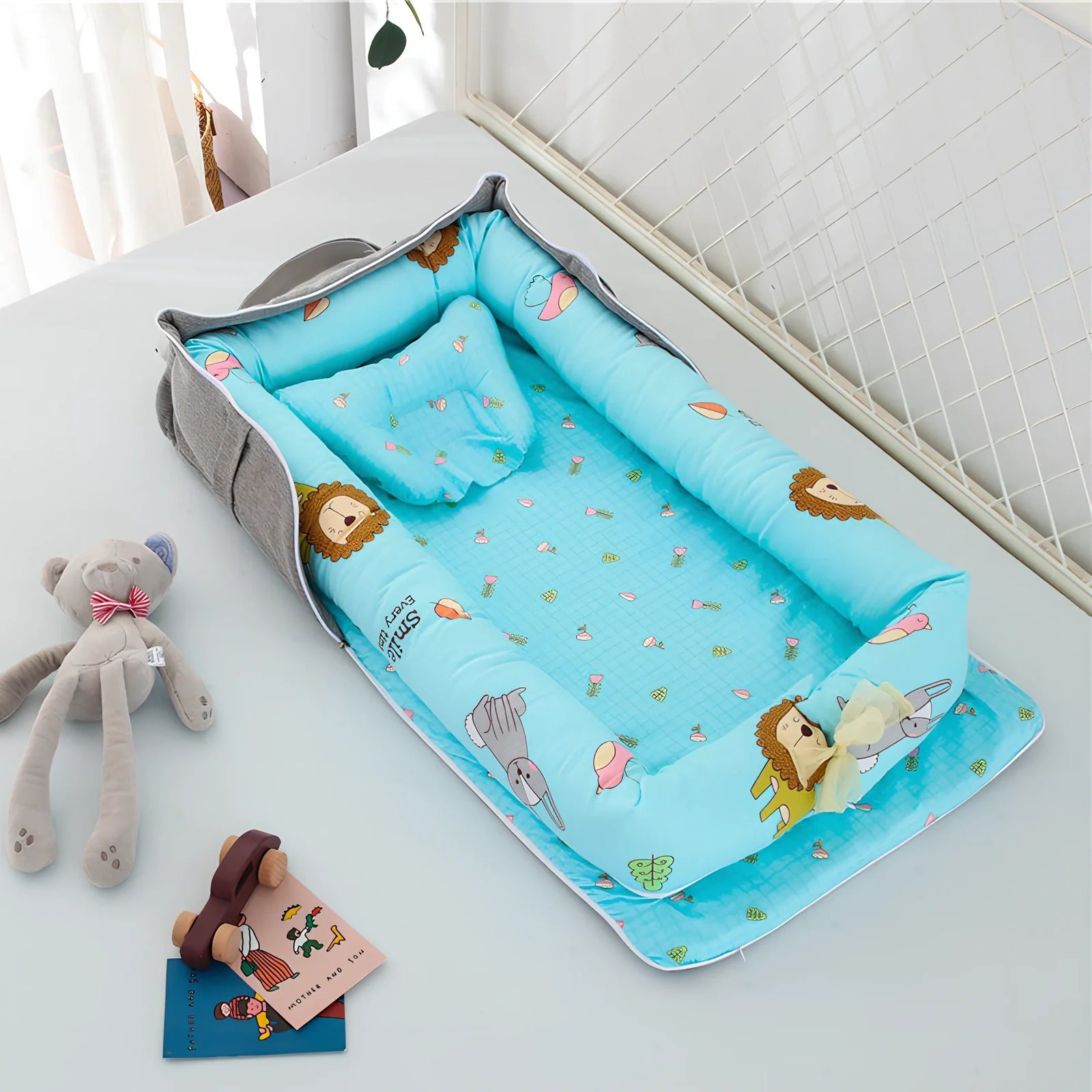 Foldable cotton portable baby crib in Animal World Blue, 90x50 cm with pillow and strap, weighing 1.3 kg