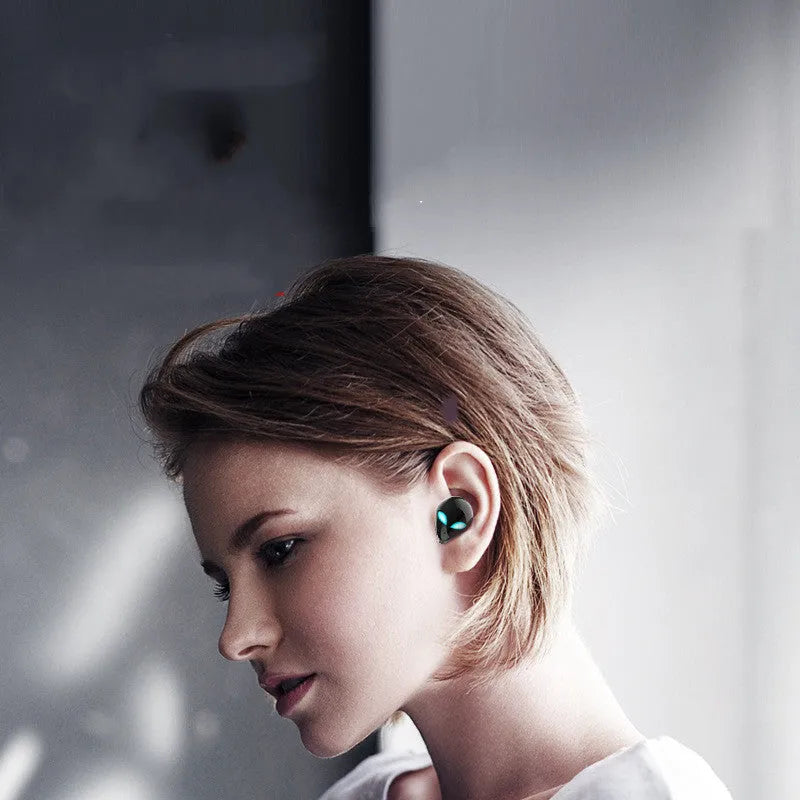 Creative Outer T8 Starman Bluetooth Headset with alien design and wireless charging case