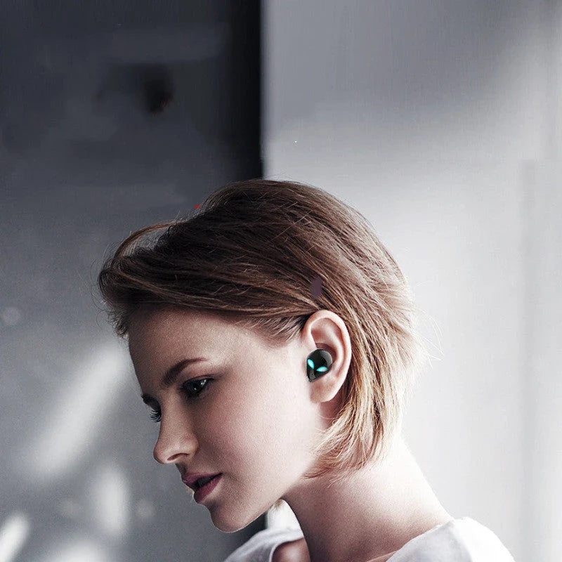 Creative Outer T8 Starman Bluetooth Headset in white and black colors with wireless charging case