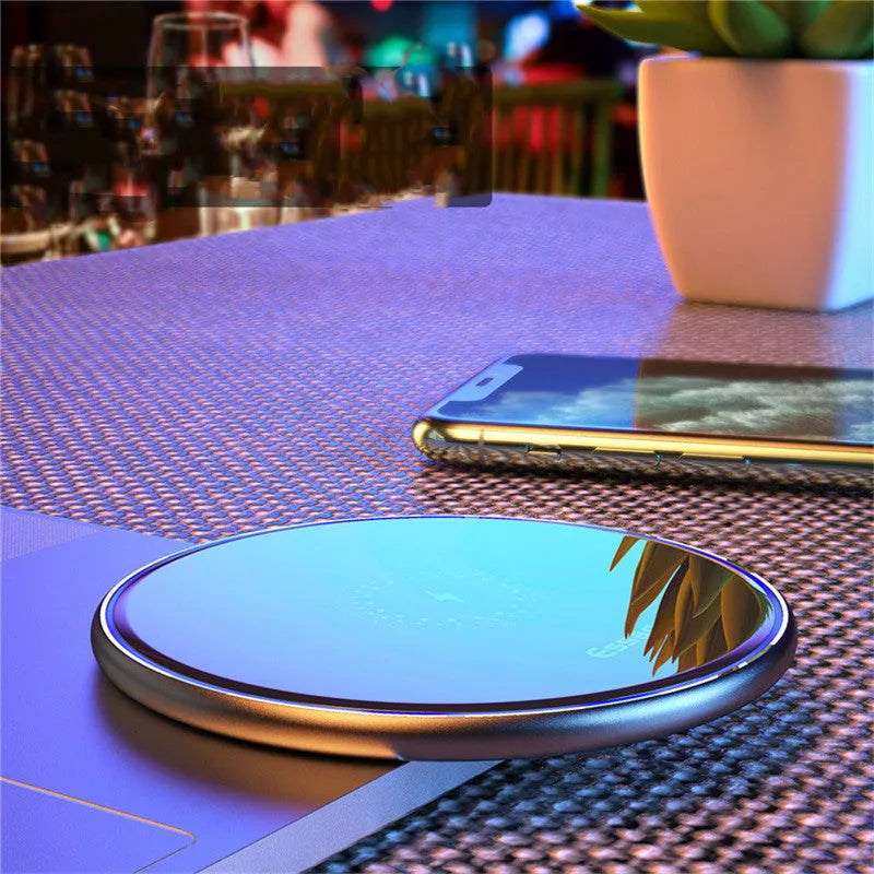 Black or white 15W fast wireless charging pad with LED light and aluminium alloy finish.