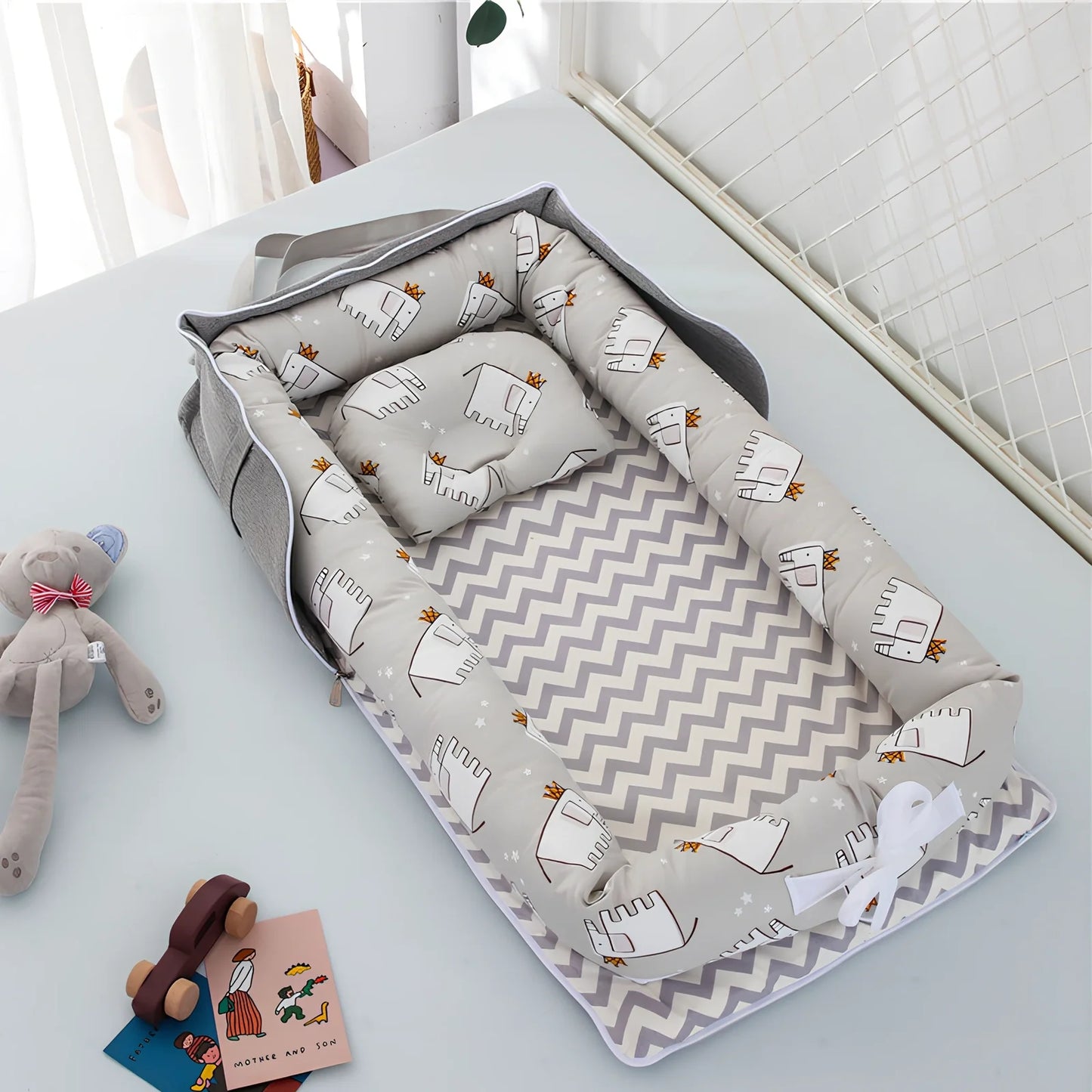 Foldable cotton portable baby crib in Animal World Blue, 90x50 cm with pillow and strap, weighing 1.3 kg