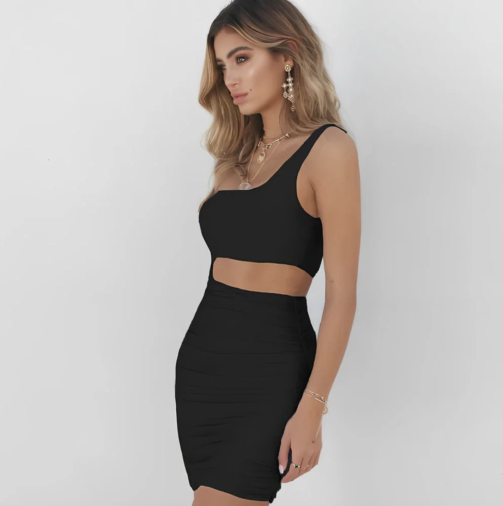 Slim one-shoulder mini dress in black polyester with wrapped chest, hollow sides, short 40cm length, sizes XS-XL