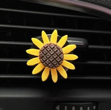 Yellow sunflower car vent perfume clip measuring 8cm with secure mounting clip for air freshening