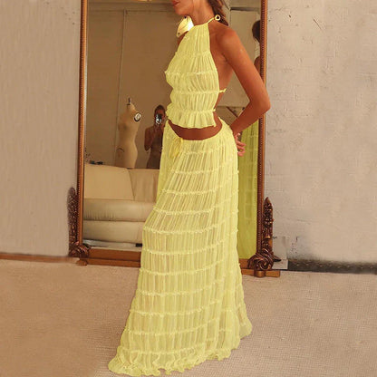 Stylish women's backless halter top and pleated maxi dress set in a variety of vibrant colors