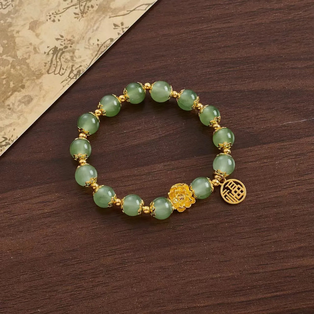 Coloured glaze Chinese bracelet with mixed materials in leaf, drop, and star shapes