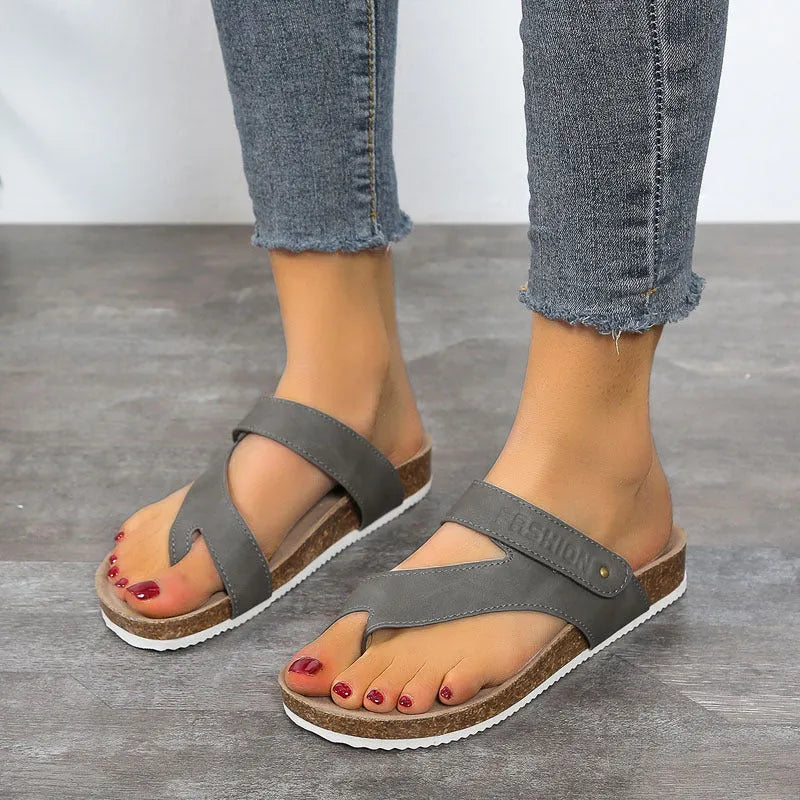 Flat toe ring flip-flops with thick foam sole in blue colour on a white background.