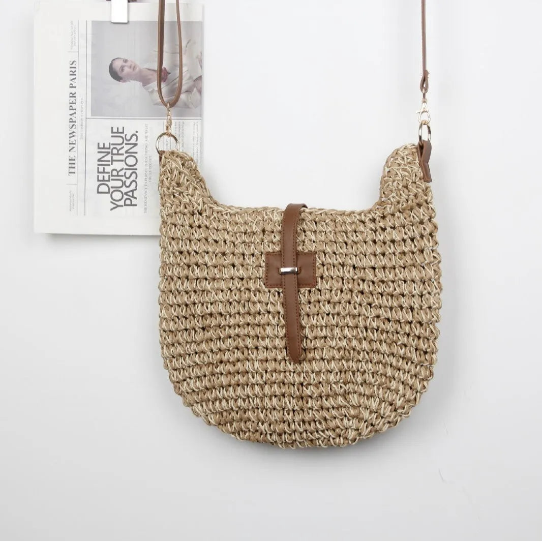 Beige handmade woven bag with a special-interest design and a long shoulder strap.