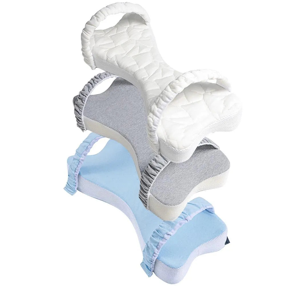 Memory cotton knee pillow in light blue on a bed, size 70x37x9cm for side sleeping support