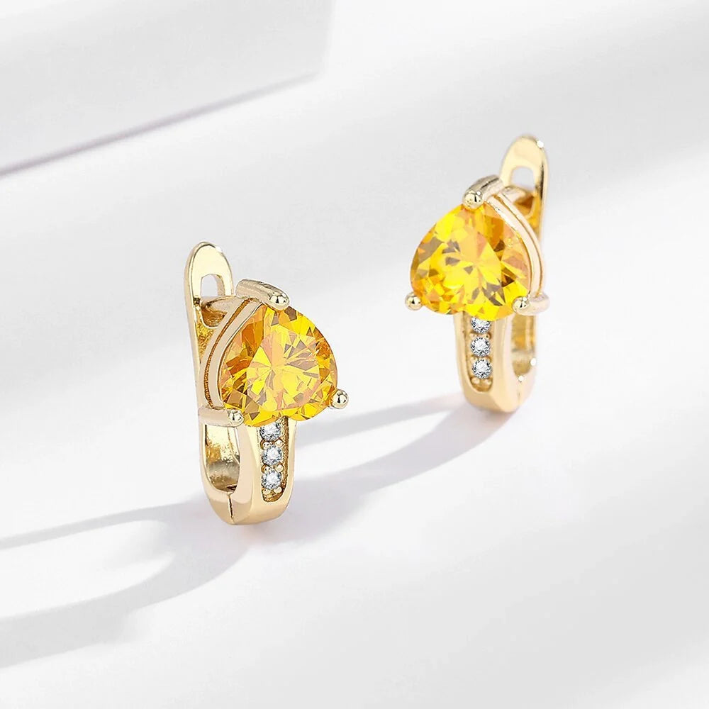 Loving Heart Zircon Ear Clips in white gold and yellow gold with diamond accents