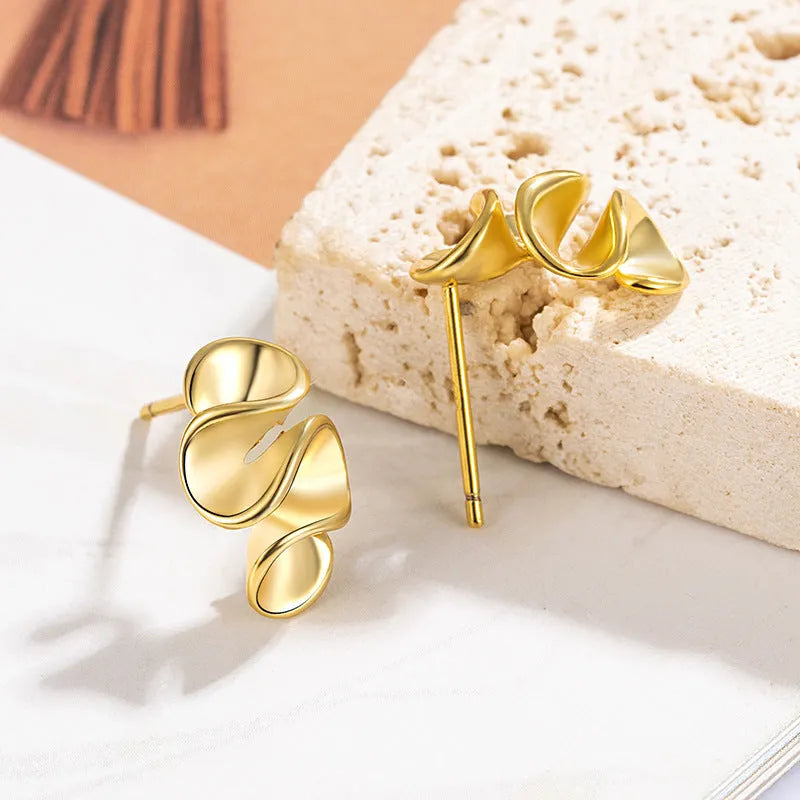 Geometric cream flower stud earrings in gold electroplated finish on copper base with irregular shape