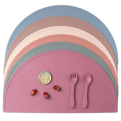 A durable, food-grade silicone placemat in various colours, suitable for Kiwi kids' mealtimes.