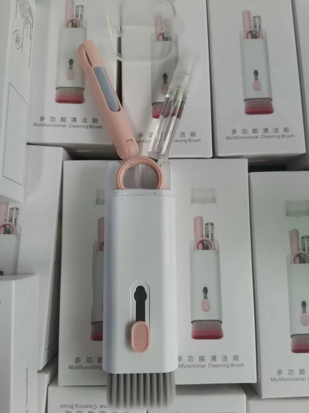 Pink and blue computer cleaning pen set with brush, keycap tool, and empty spray bottle