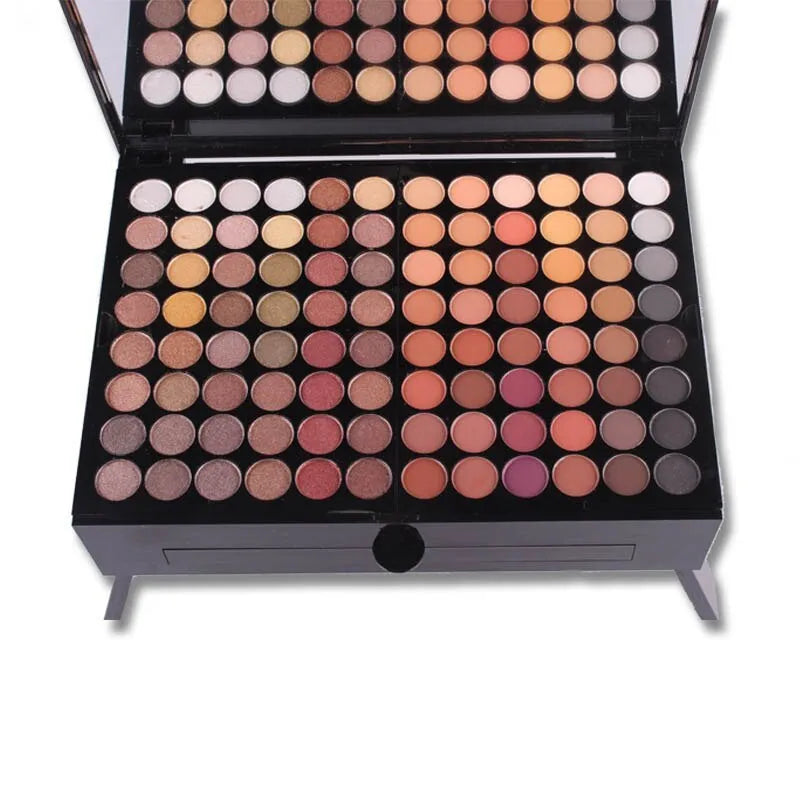 Piano-shaped box open to show 180 colour eyeshadow palette with blushes and contour powders