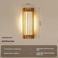New Chinese style walnut wall lamp with wood art finish in a living room setting