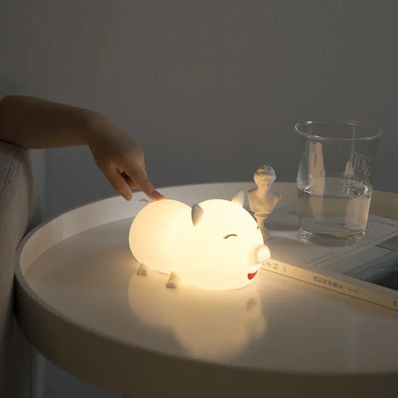 Dudu pig cartoon plastic night light with silicone shade emitting warm yellow and colourful LED glow