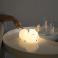 Dudu pig cartoon plastic night light with silicone shade emitting warm yellow and colourful LED glow