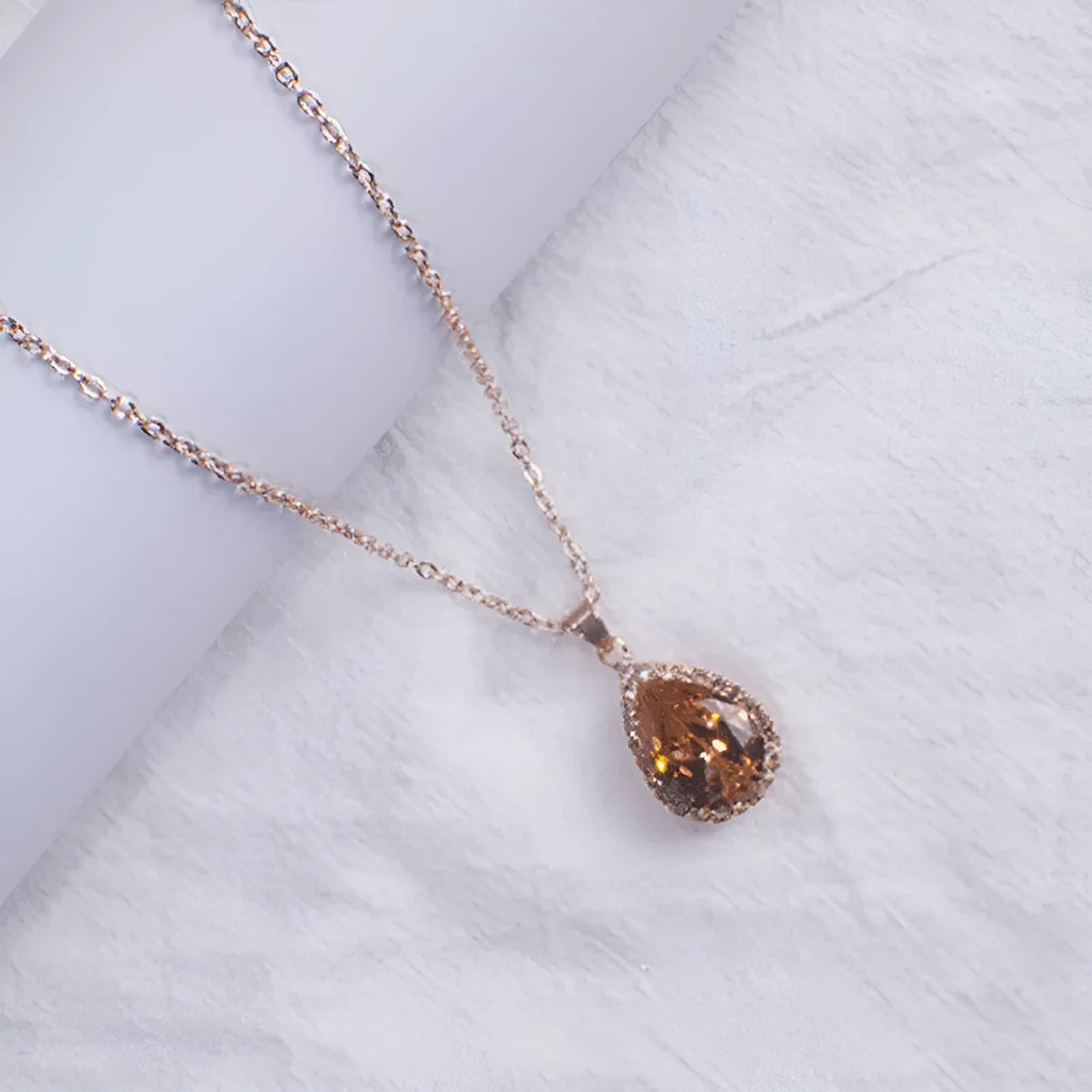 Women's alloy drop necklace with geometric rhinestone pattern in pink rose gold colour