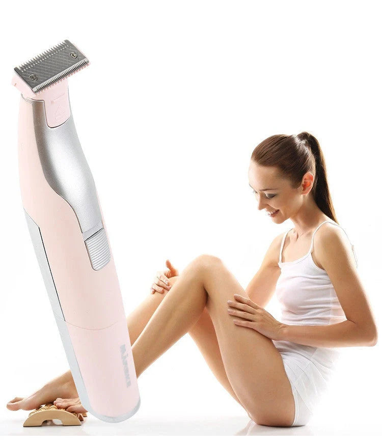 Portable hair shaver in pink and green with detachable comb for precise styling