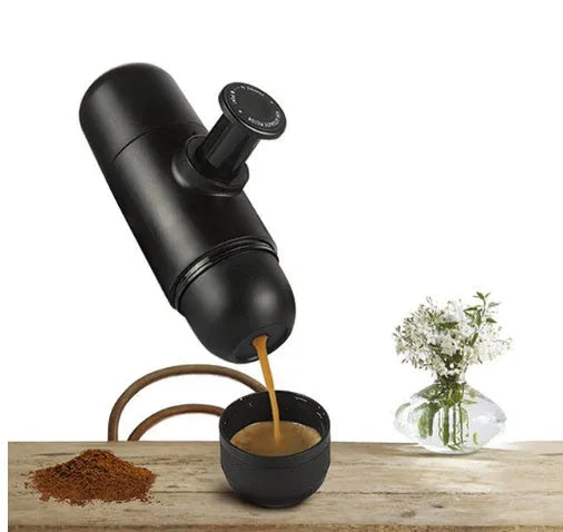 Black portable manual espresso maker showing compact 17.5cm height and 6cm diameter.