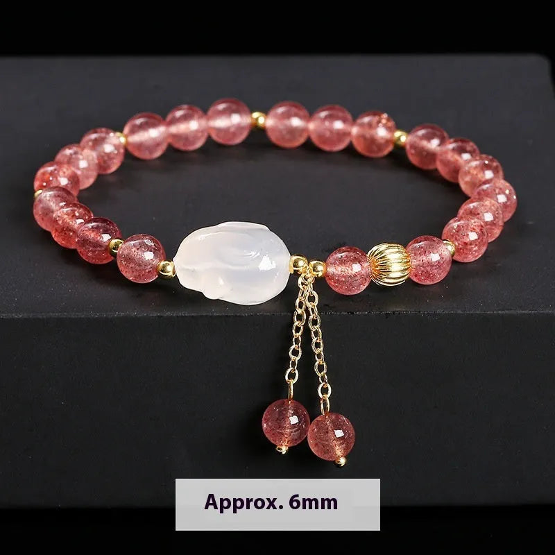 Women's strawberry quartz agate bracelet with 6mm geometric beads and White Rabbit design