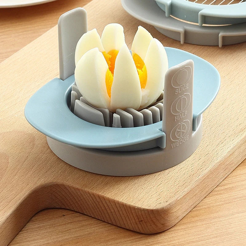 Three-in-one egg cutting gadget in red, blue, and orange colours