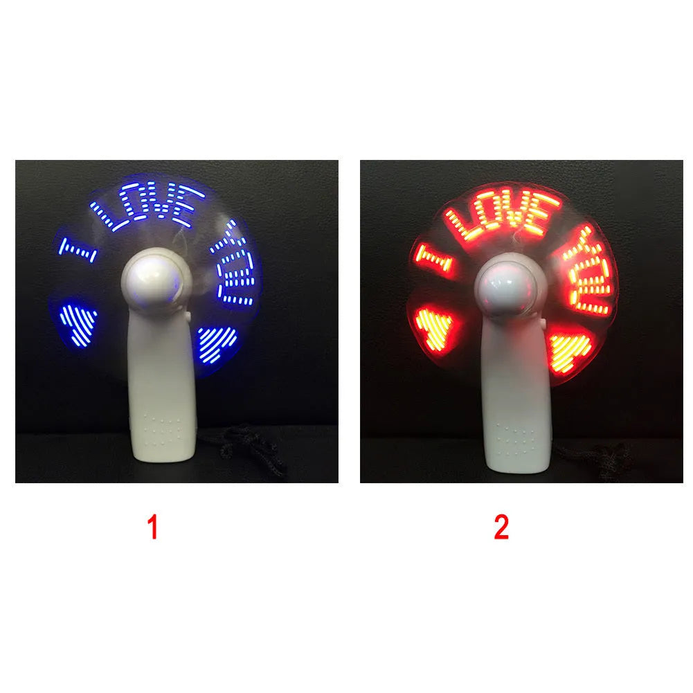 White handheld mini fan with a flashing LED love pattern display.