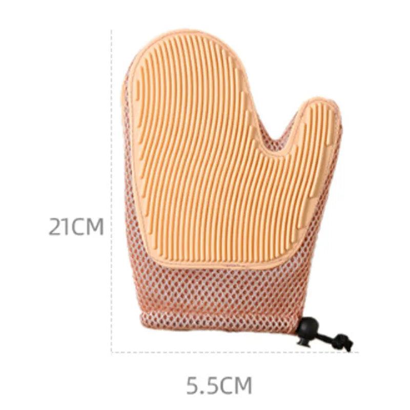 Dark blue mesh pet hair remover glove shown on a hand, with loose pet hair collected on its surface