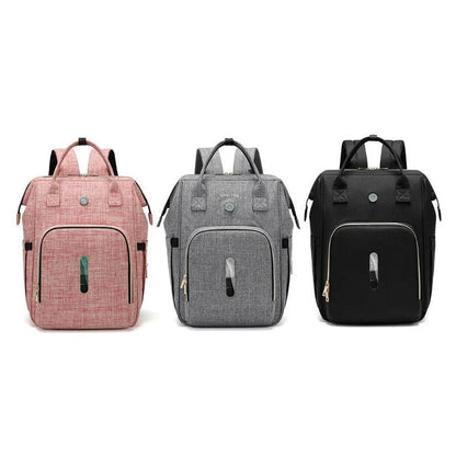 Sterilizing mother and baby bag in pink, black, and dark grey with milk bottle compartment