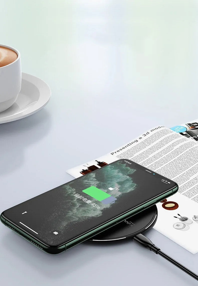 Black Kuulaa wireless disc phone charger with Micro USB port and LED indicator light