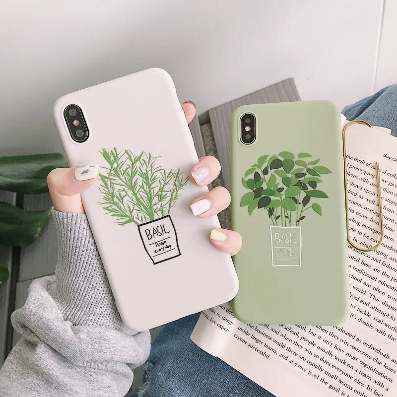 White silicone iPhone case with painted plant pattern design showing 360-degree edge protection