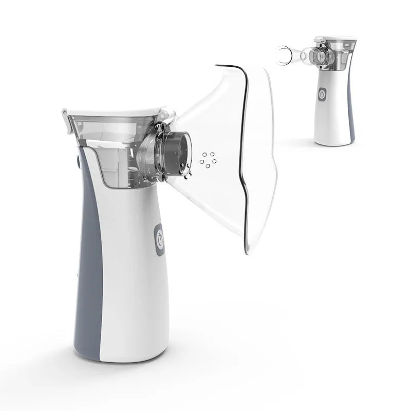White handheld microporous medical nebuliser with mouthpiece, compact size 50x48x130mm