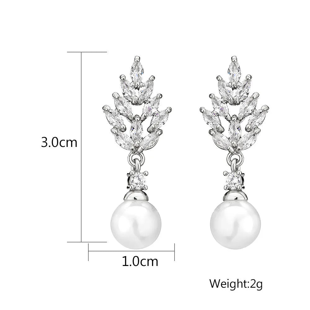 Geometric flower earrings with micro inlaid zircon stones and pearl elements in three plating colours
