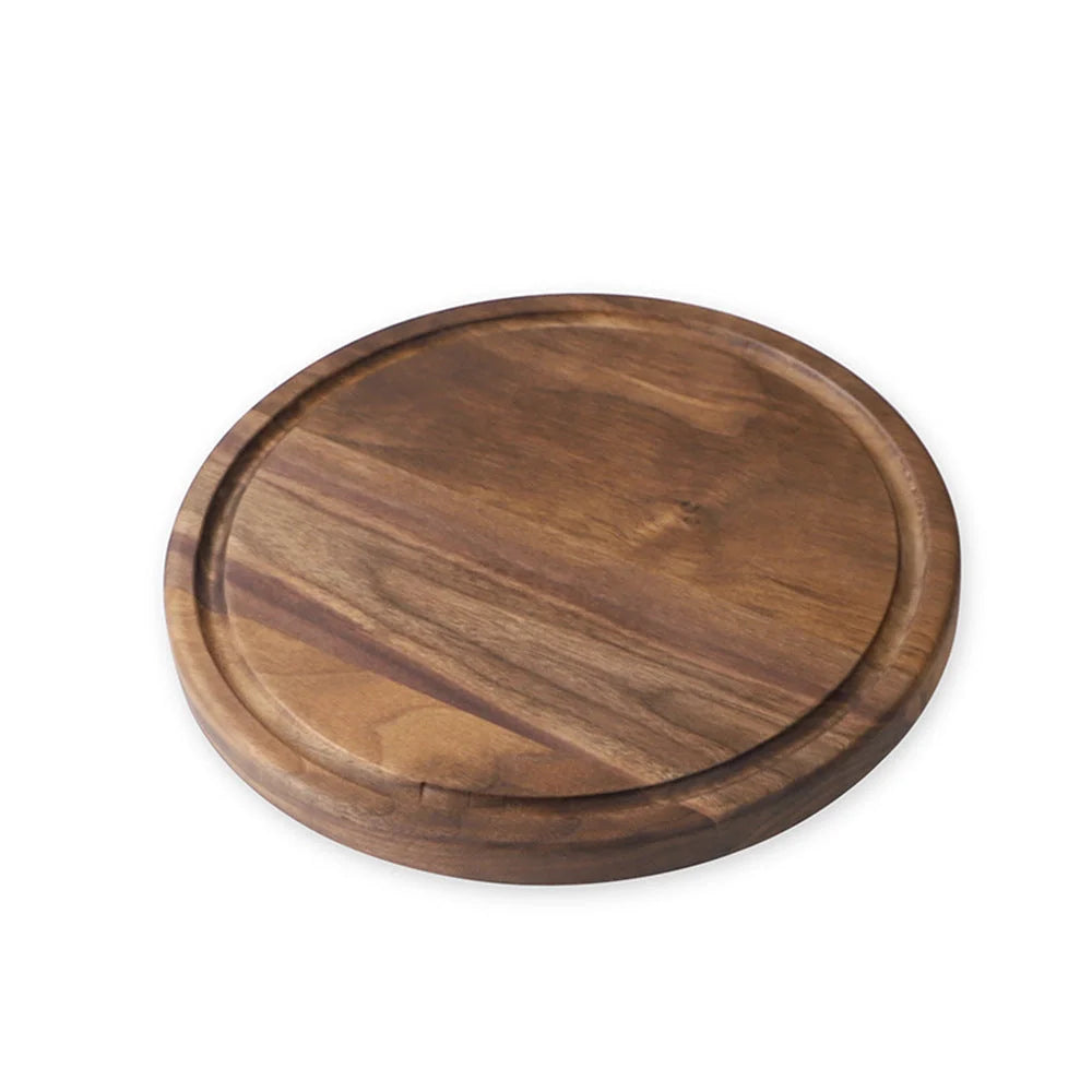 Black walnut wood cutting board with engraved handle and groove design for kitchen use