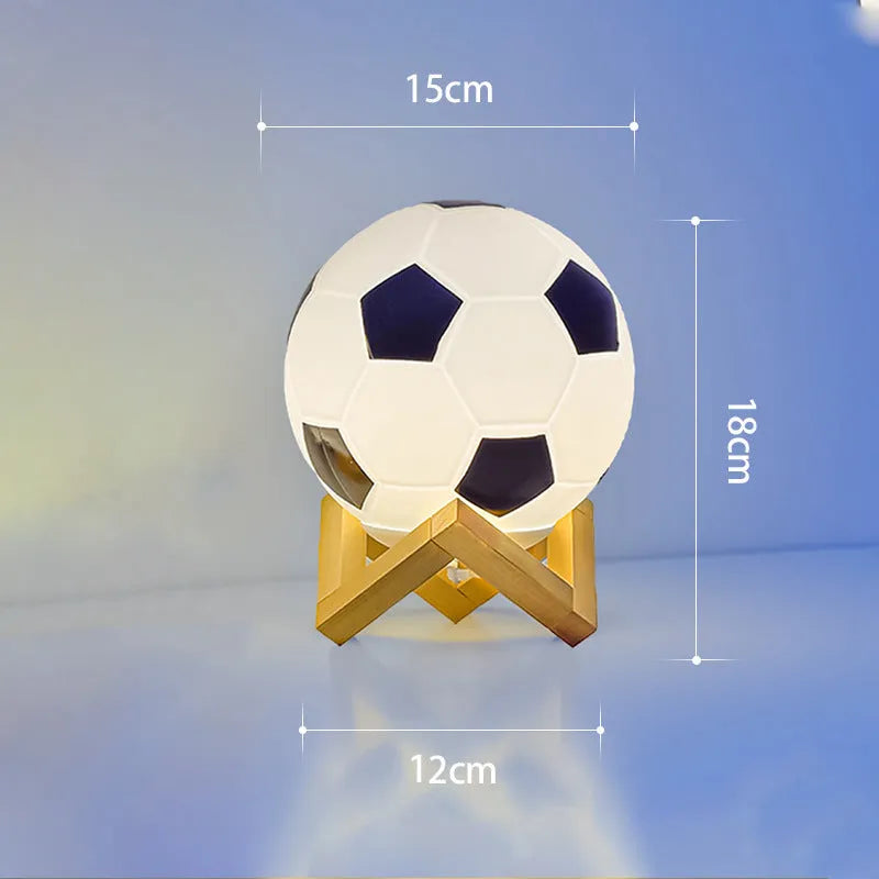 Football LED small night lamp with glass shade and remote control on a bedside table